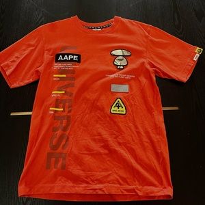 Orange Bape tee.